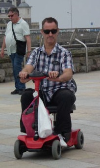 Andy with mobility scooter